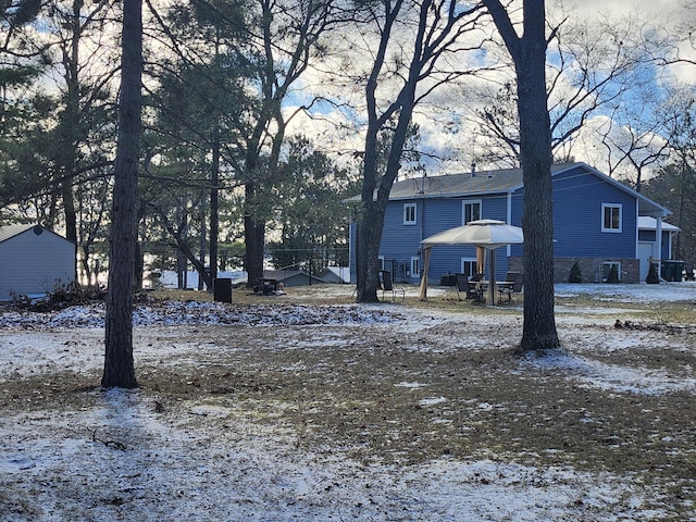 view of yard covered in snow