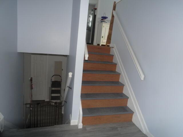 stairs with wood finished floors