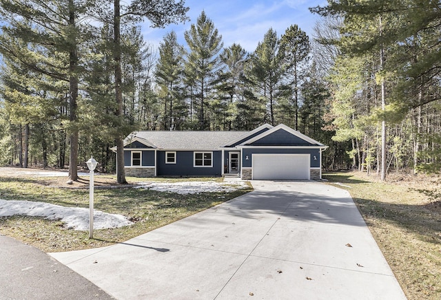 ranch-style house with concrete driveway, an attached garage, and stone siding