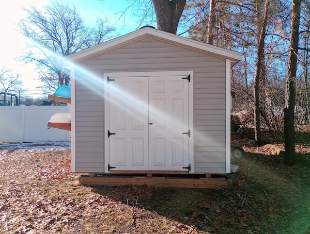 view of shed with fence