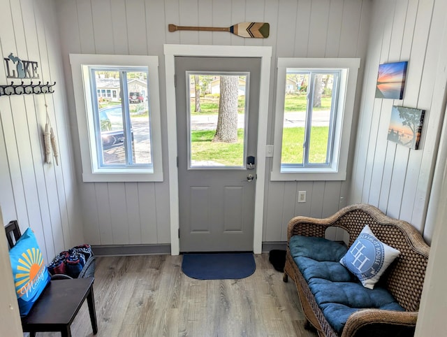 doorway to outside featuring wood finished floors