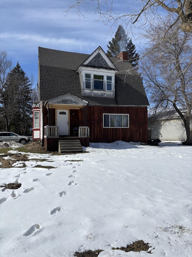 view of front of house featuring roof with shingles