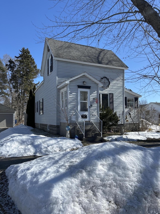 view of front of house featuring a shingled roof