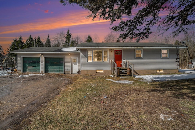 view of front facade featuring crawl space, an attached garage, and dirt driveway