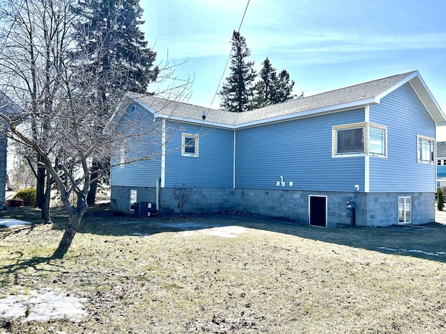 view of home's exterior with central AC unit