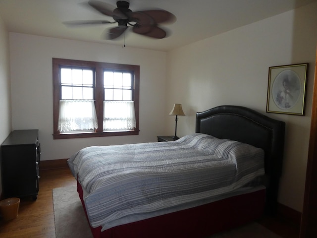 bedroom featuring hardwood / wood-style floors and ceiling fan