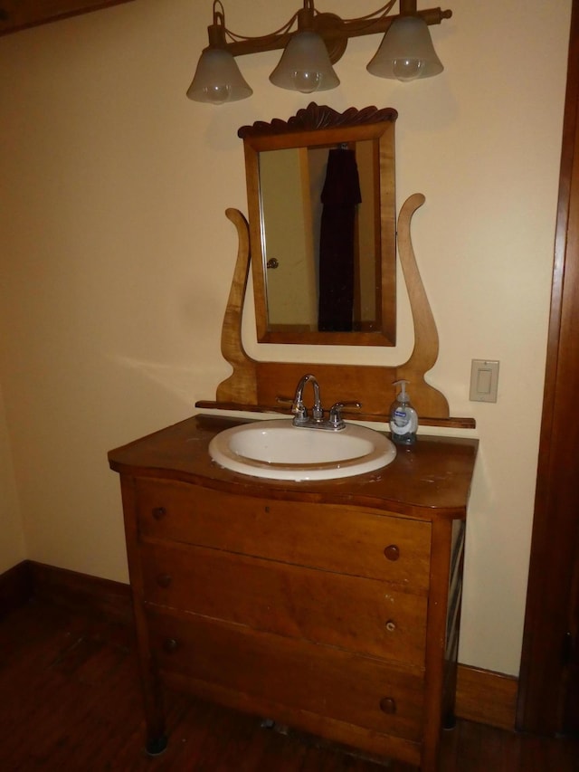 bathroom with vanity and hardwood / wood-style flooring