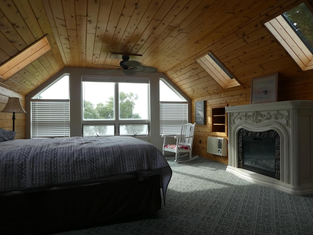 unfurnished bedroom with carpet, an AC wall unit, wood ceiling, lofted ceiling with skylight, and a high end fireplace