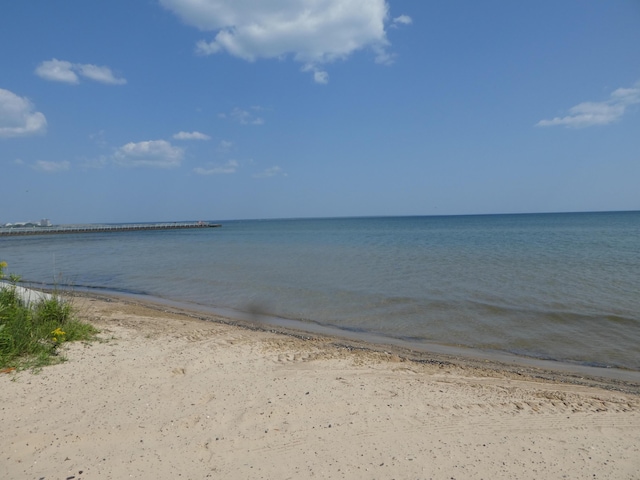 property view of water featuring a view of the beach