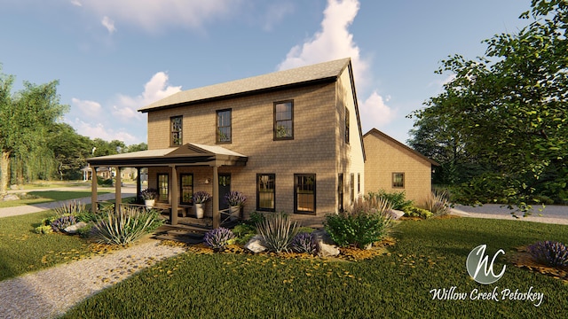 view of front of property featuring covered porch and a front yard