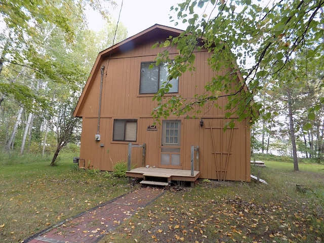 rear view of house with a wooden deck