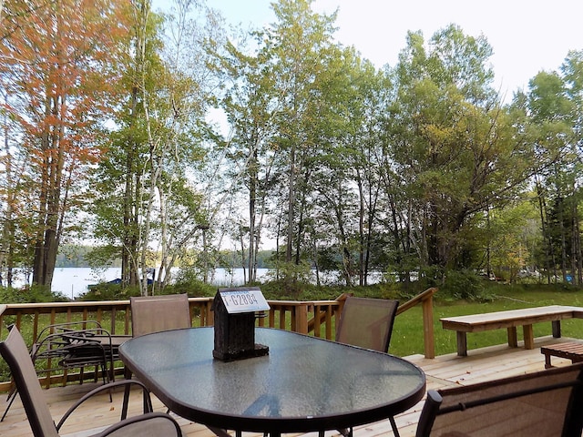 wooden deck featuring a water view