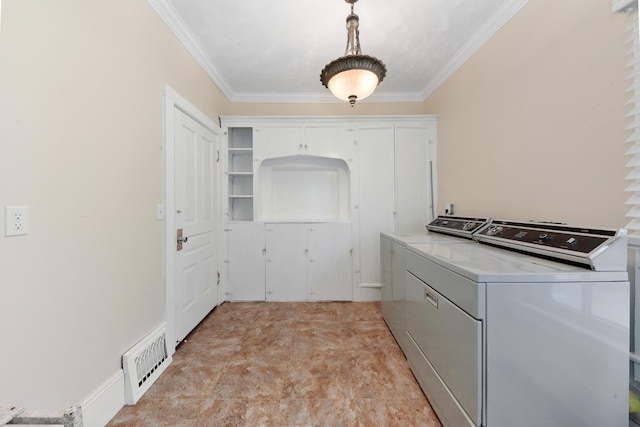 washroom featuring independent washer and dryer, crown molding, and light tile floors