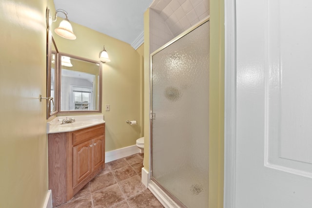 bathroom with tile floors, a shower with shower door, toilet, ornamental molding, and oversized vanity