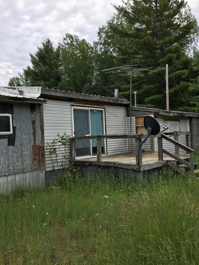 rear view of property with a deck