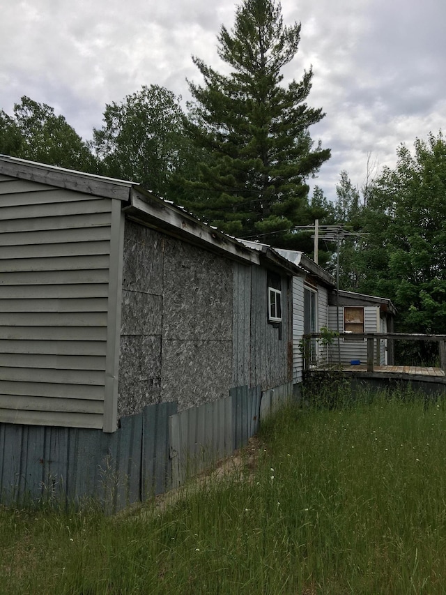 view of property exterior featuring a deck