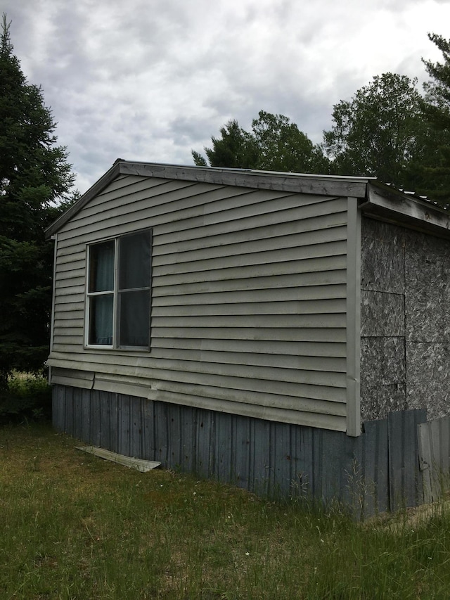 view of property exterior featuring a yard