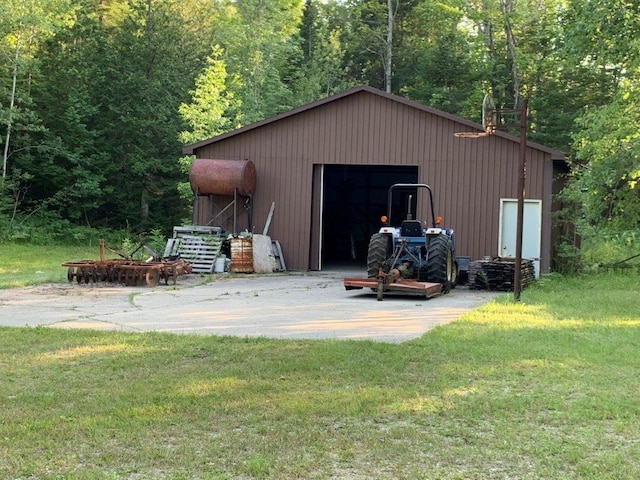 view of shed / structure featuring a yard and a garage