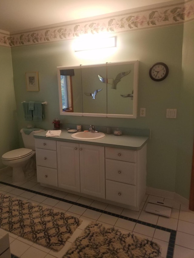 bathroom with vanity, tile flooring, and toilet