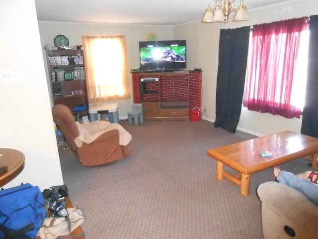 living room with a chandelier, dark carpet, and a fireplace