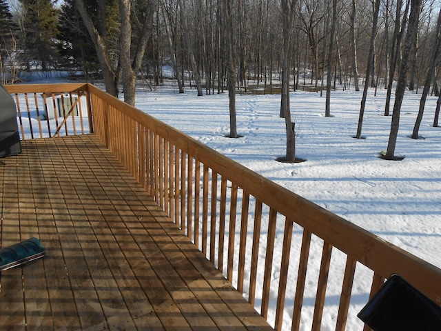 view of snow covered deck