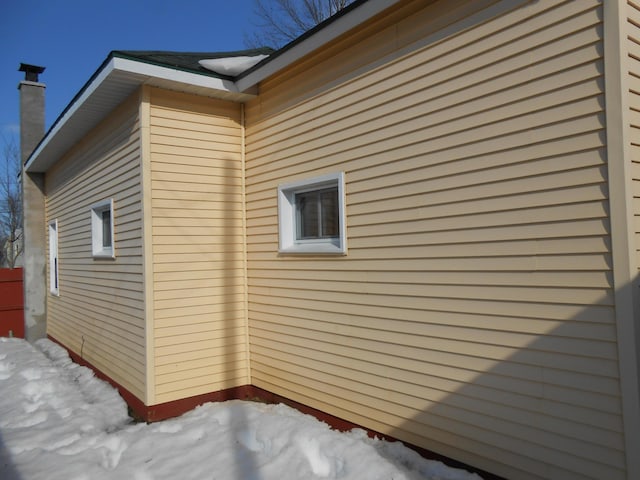 view of snow covered property