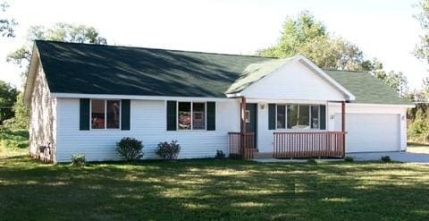 ranch-style house with a front lawn and a garage