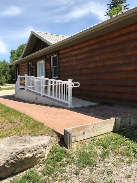 view of property exterior with a deck