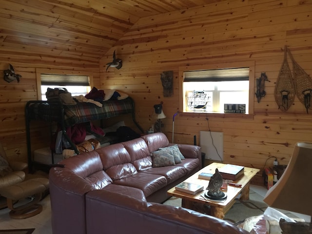 living room with wooden walls, wooden ceiling, and vaulted ceiling