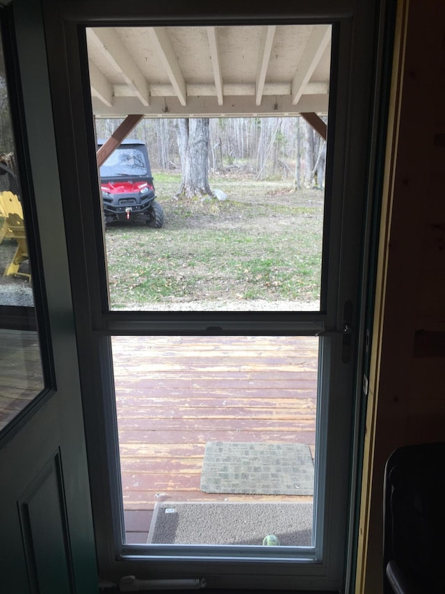 entryway featuring beam ceiling