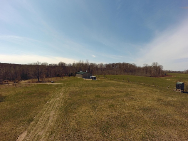 view of yard with a rural view