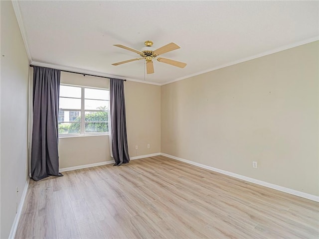 spare room with light hardwood / wood-style floors, ceiling fan, and ornamental molding