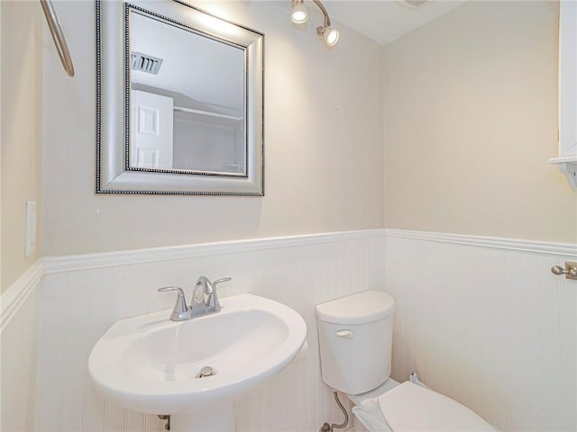 bathroom with toilet and sink