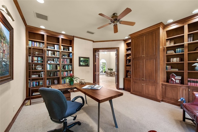 office area featuring light carpet, built in features, ornamental molding, and ceiling fan