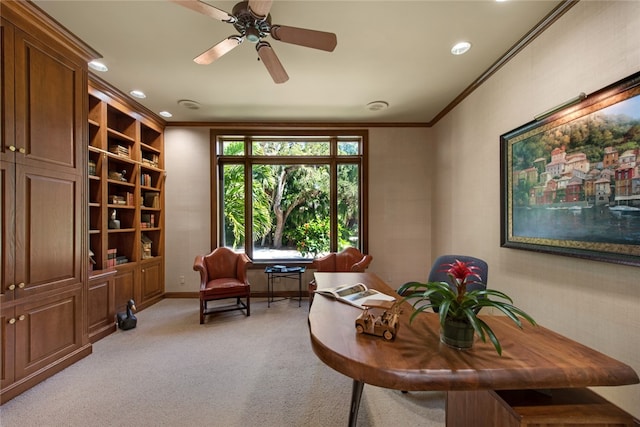 living area with crown molding, ceiling fan, and light carpet