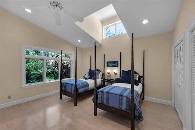 bedroom featuring lofted ceiling, ceiling fan, and light wood-type flooring