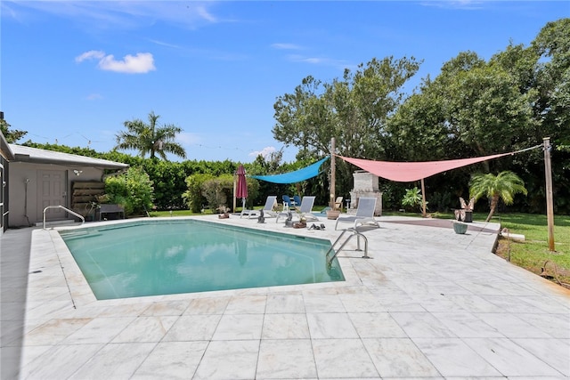 view of swimming pool with a patio area