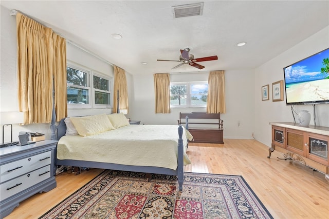 bedroom featuring wood-type flooring and ceiling fan