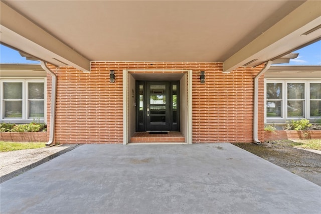 property entrance featuring a patio area