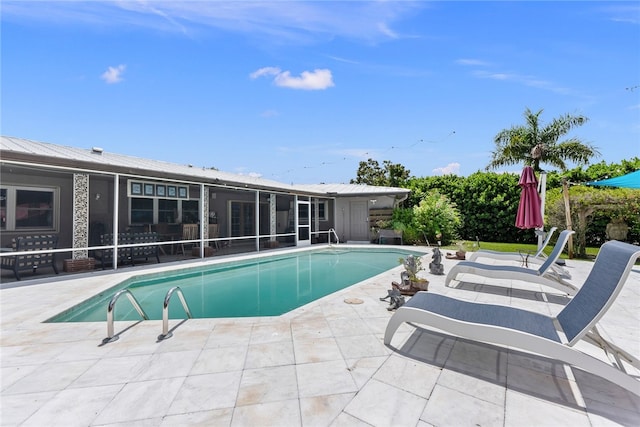 view of swimming pool with a patio area