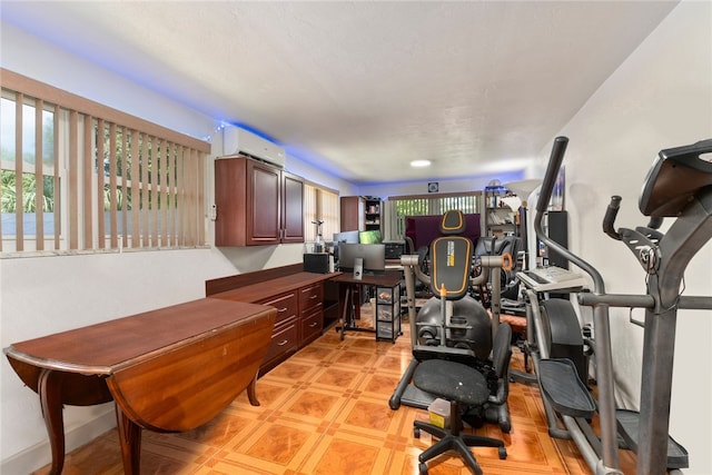 workout area with a wall mounted air conditioner