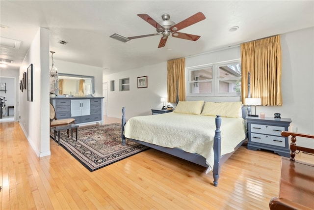 bedroom with light hardwood / wood-style floors and ceiling fan