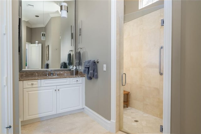 bathroom featuring crown molding, vanity, and an enclosed shower