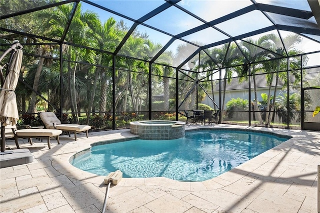 view of pool featuring an in ground hot tub, a patio, and glass enclosure