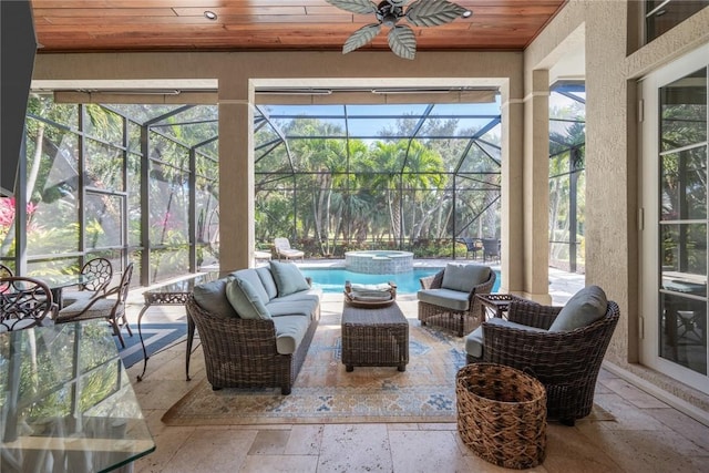 sunroom with wood ceiling and ceiling fan