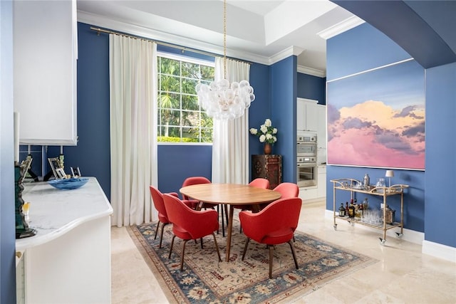 dining space featuring an inviting chandelier and ornamental molding