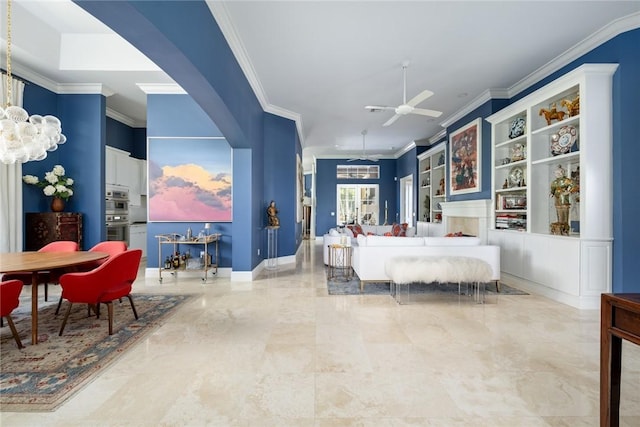 bedroom with crown molding and ceiling fan with notable chandelier