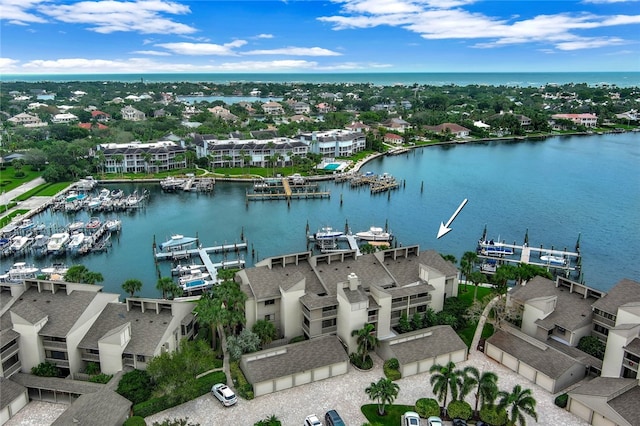 birds eye view of property featuring a water view