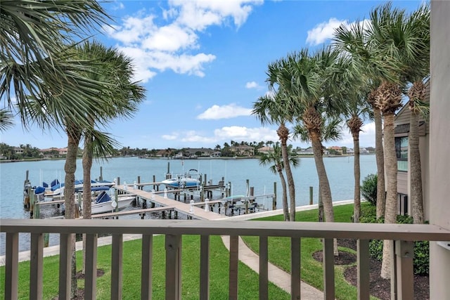 1875 Bay Rd Unit 215H, Vero Beach, FL 32963 - dock featuring boat lift, a water view, and a yard