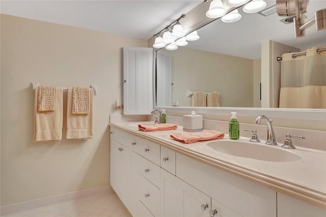 bathroom with tile patterned flooring and vanity